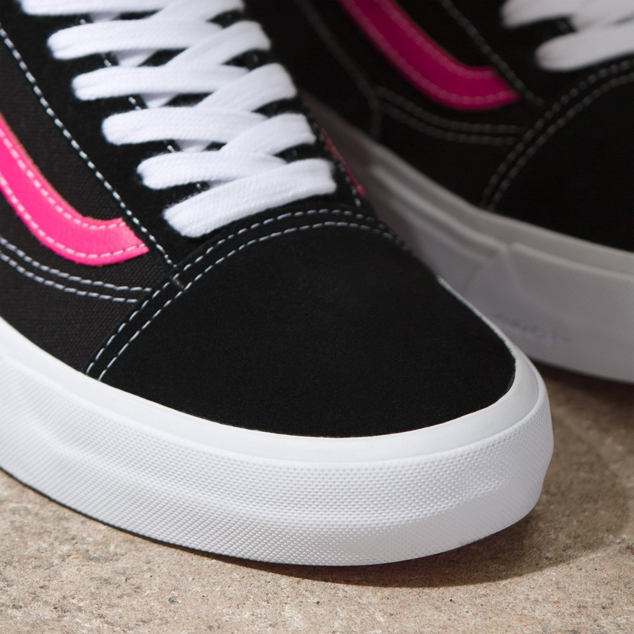 Black and pink old skool vans